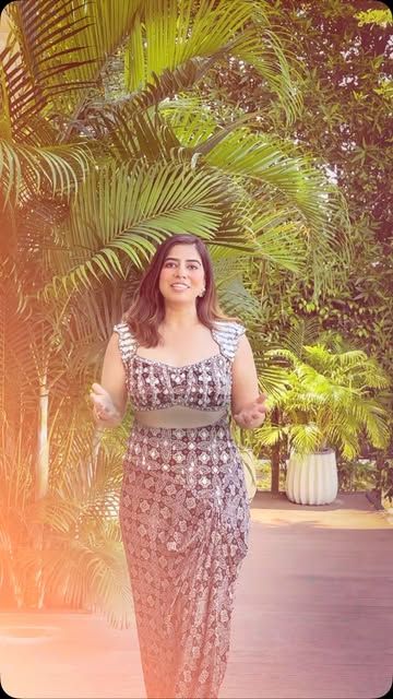 Mirror-work halter gown by JIVA, worn outdoors