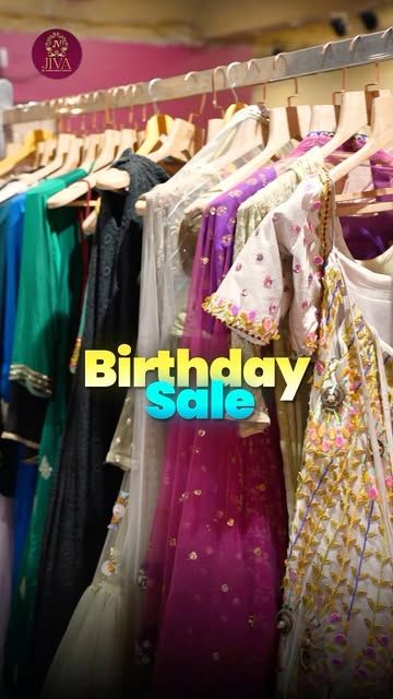 Racks of embroidered outfits at JIVA